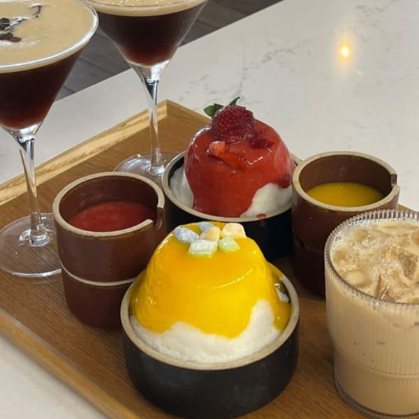Cafe Mixx desserts: two espresso martinis, strawberry and mango shaved ice, and an iced coffee.